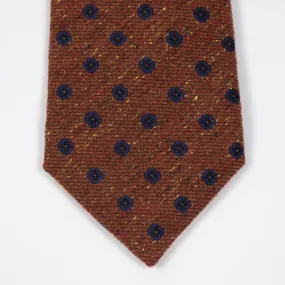 Rust silk and wool donegal tie, navy neat motifs