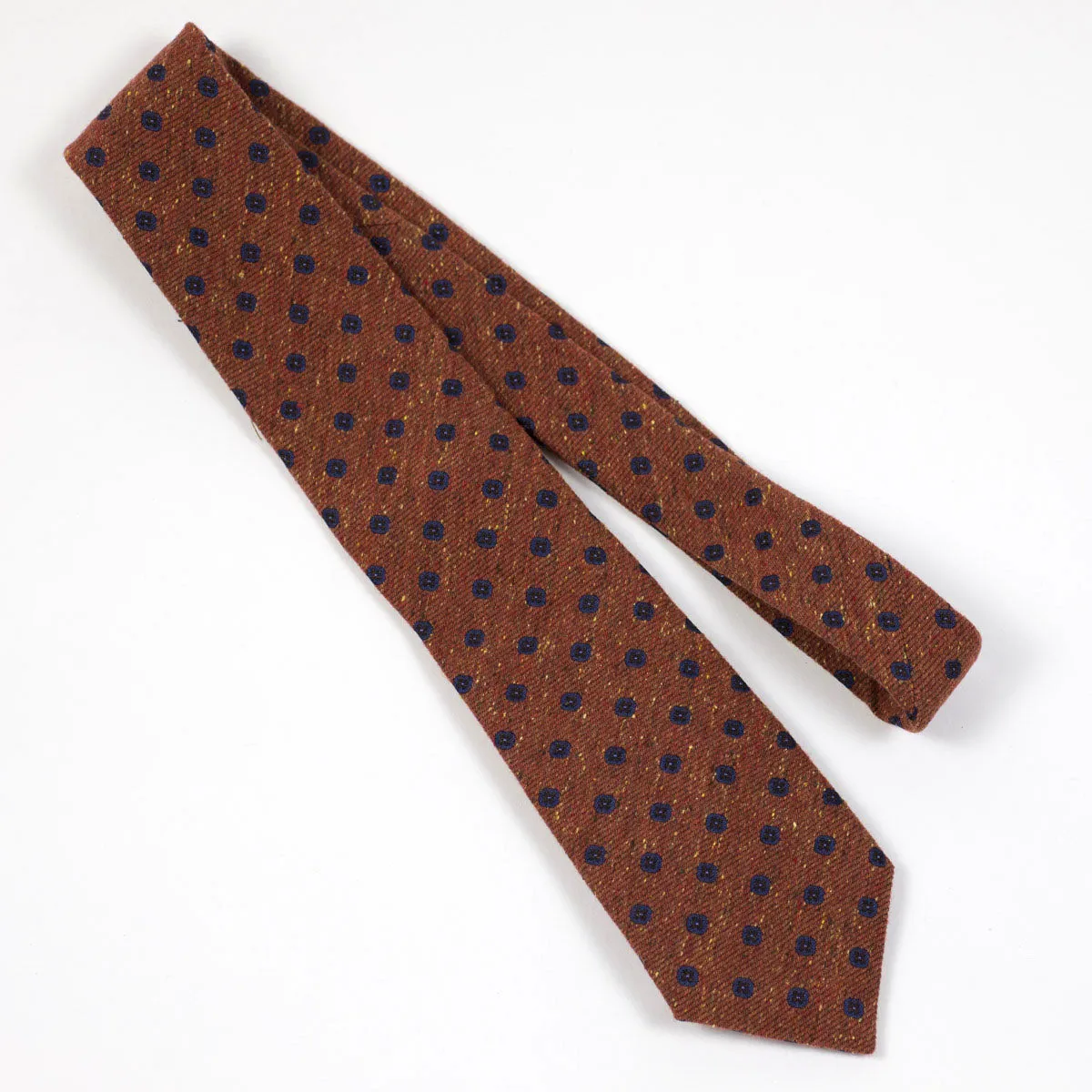 Rust silk and wool donegal tie, navy neat motifs