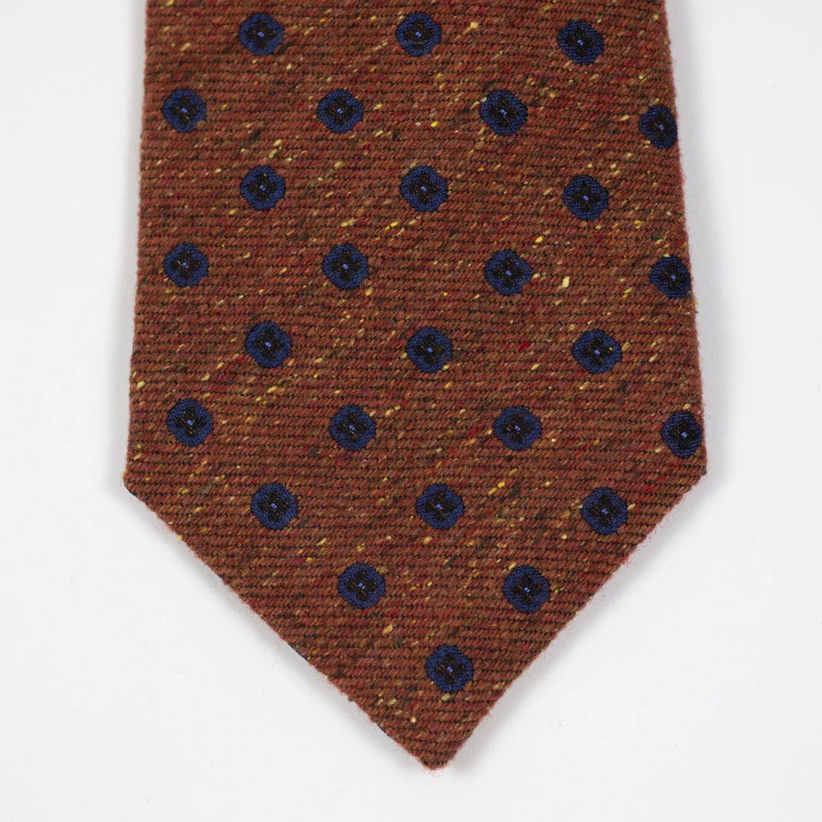 Rust silk and wool donegal tie, navy neat motifs